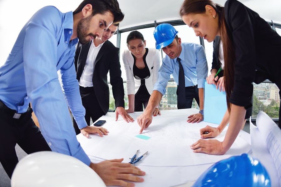 business people group on meeting and presentation in bright mod